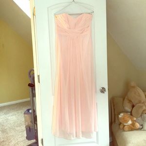 Strapless pink flowing gown.